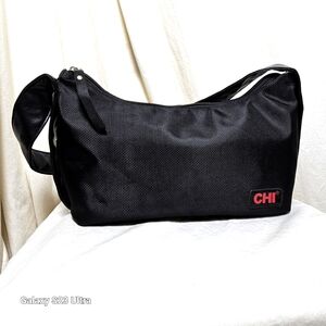 Chi hobo style bag black in like new condition with pockets and zipper inside